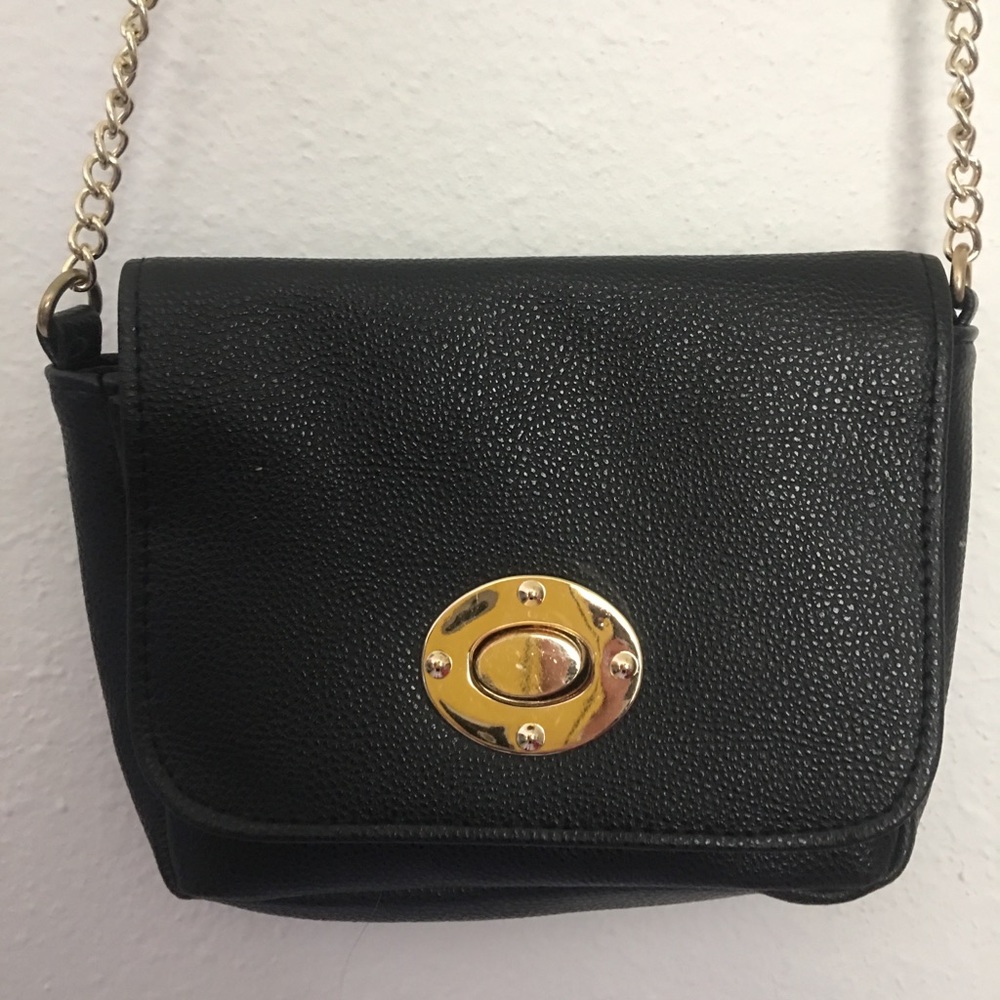 Black purse golden accents and chain